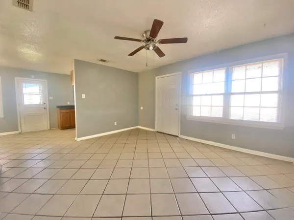 a view of an empty room and window