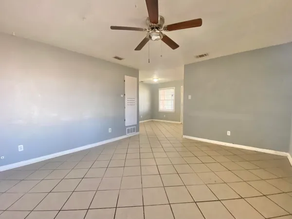 a large bathroom with a sink and a large mirror