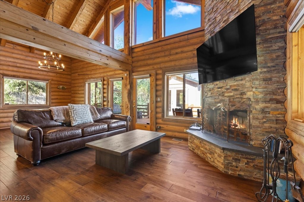 4947 Snow White Road Mount Charleston, NV 89124 - Photo 10 of 92 Vaulted ceilings w/wall of view windows, romantic woodburning fireplace w/custom hearth.