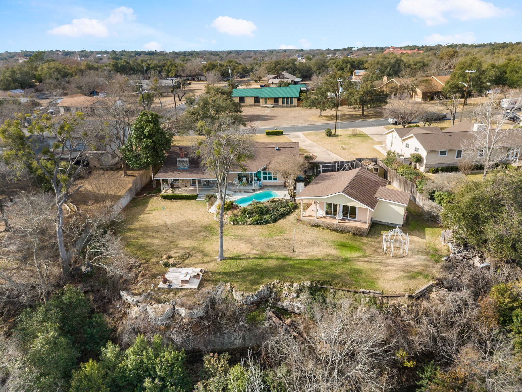 A Riverfront Retreat on a sprawling .70-acre lot along the San Gabriel River in Oakcrest Estates.