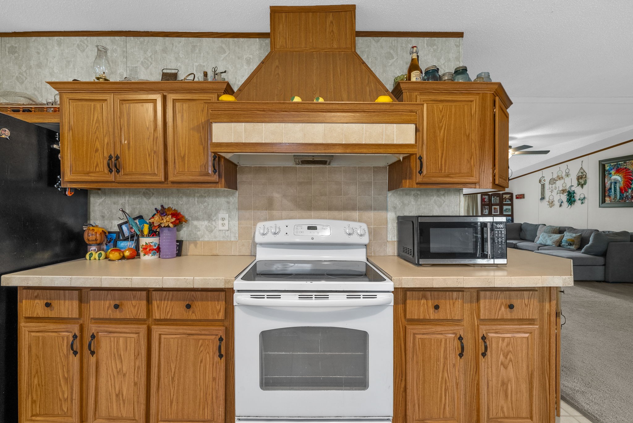 197 Old Homestead Road Big Sandy, TN 38221 - Photo 15 of 59 a stove top oven sitting inside of a kitchen