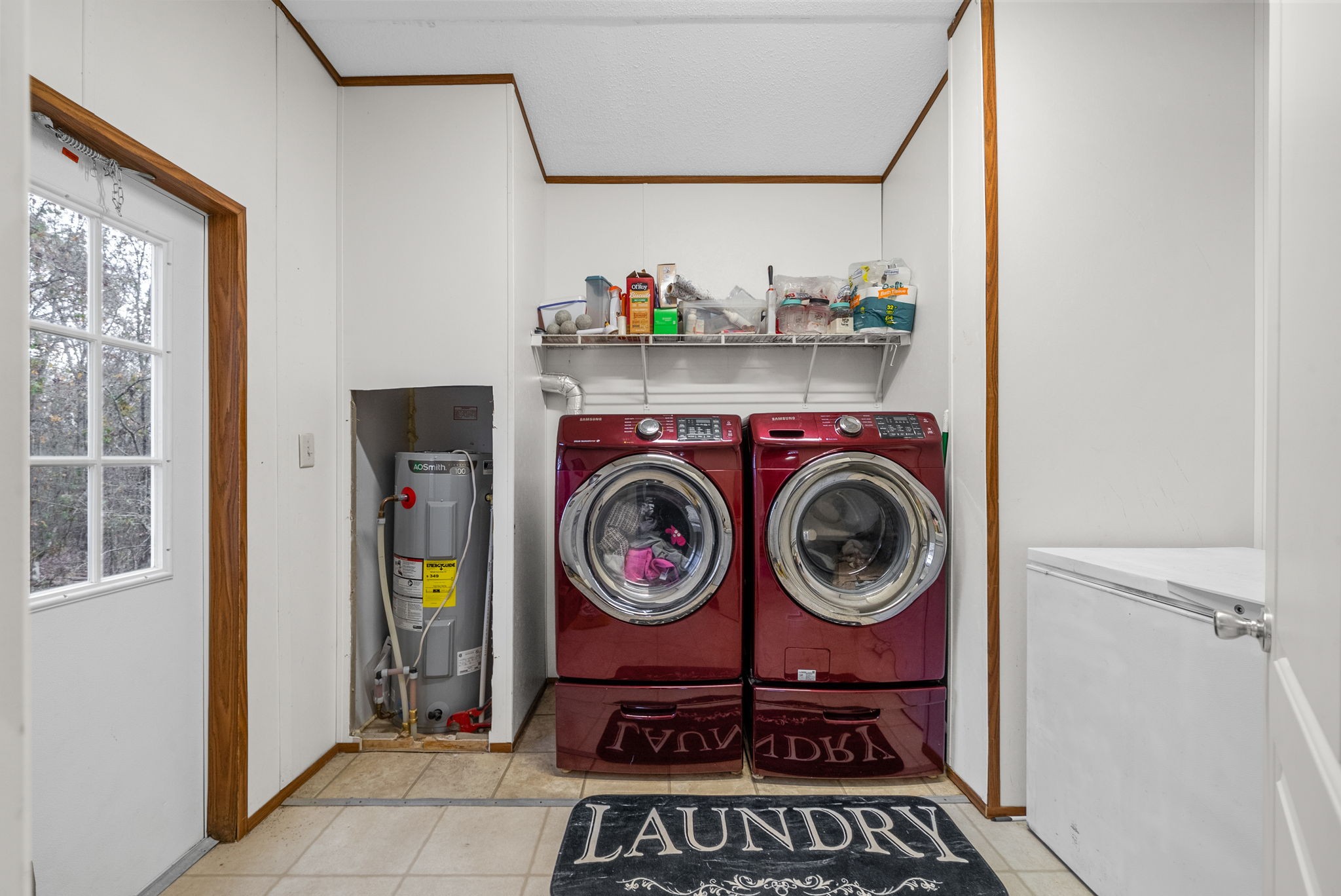 197 Old Homestead Road Big Sandy, TN 38221 - Photo 19 of 59 a utility room with dryer and washer