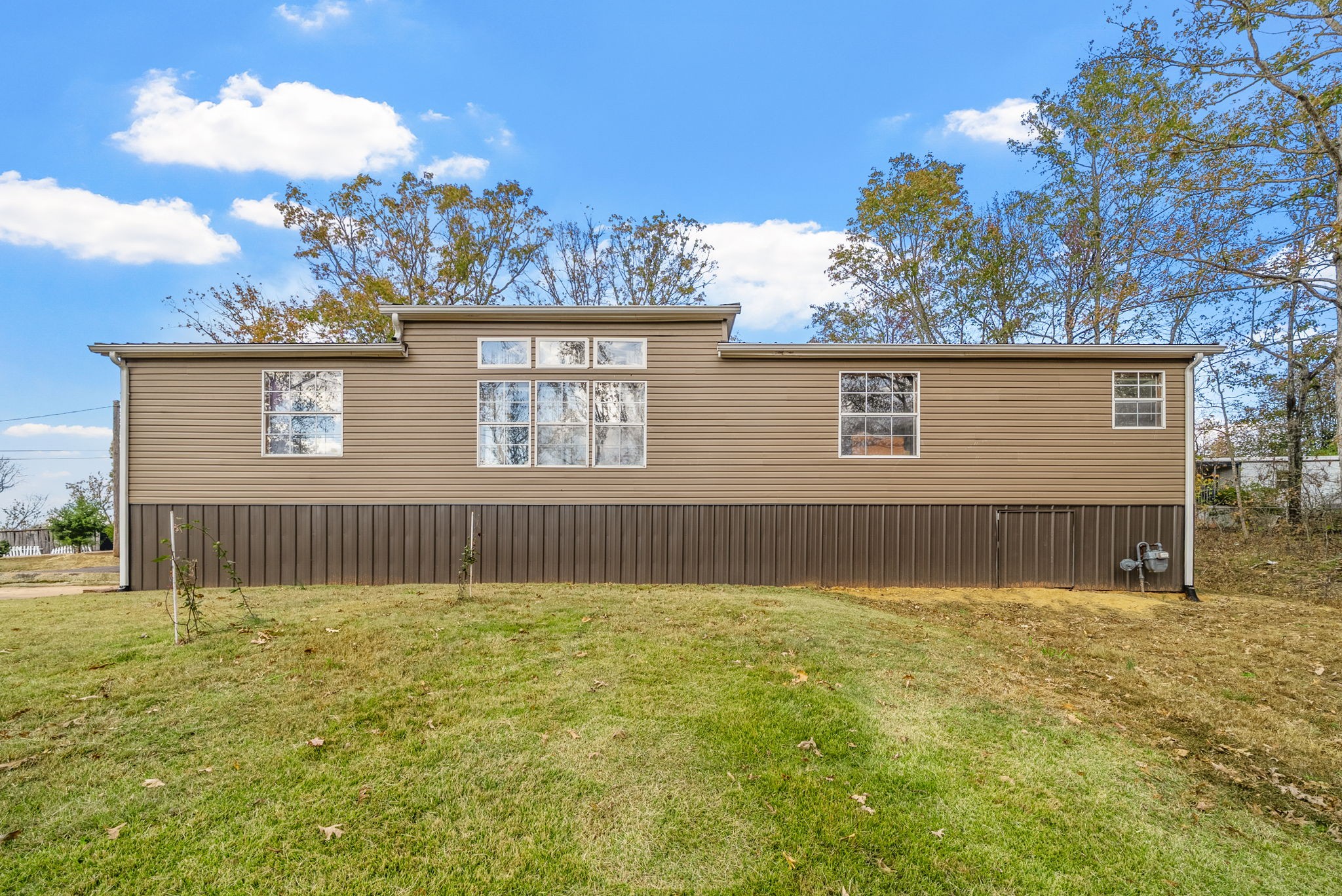 197 Old Homestead Road Big Sandy, TN 38221 - Photo 32 of 59 a view of a house with a yard