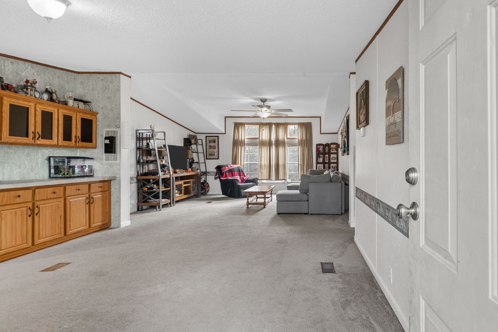 197 Old Homestead Road Big Sandy, TN 38221 - Photo 8 of 59 a living room with furniture and a large window
