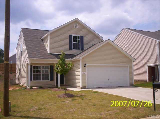 3717 Cyrus Street Raleigh, NC 27610 - Photo 3 of 3 a front view of a house with garage
