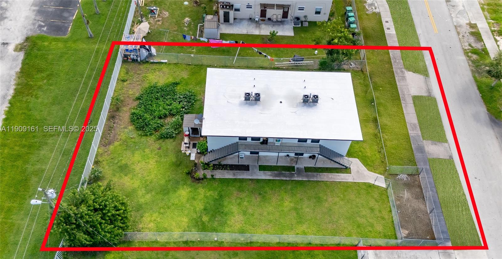 10015 Southwest 170th Terrace Miami, FL 33157 - Photo 13 of 14 a aerial view of multiple houses with yard