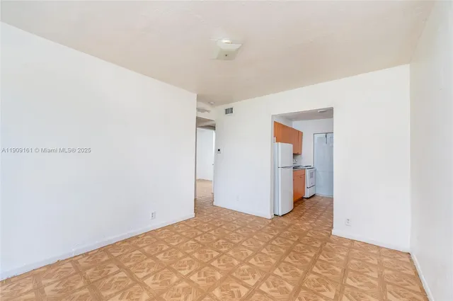 a view of a room with a hallway