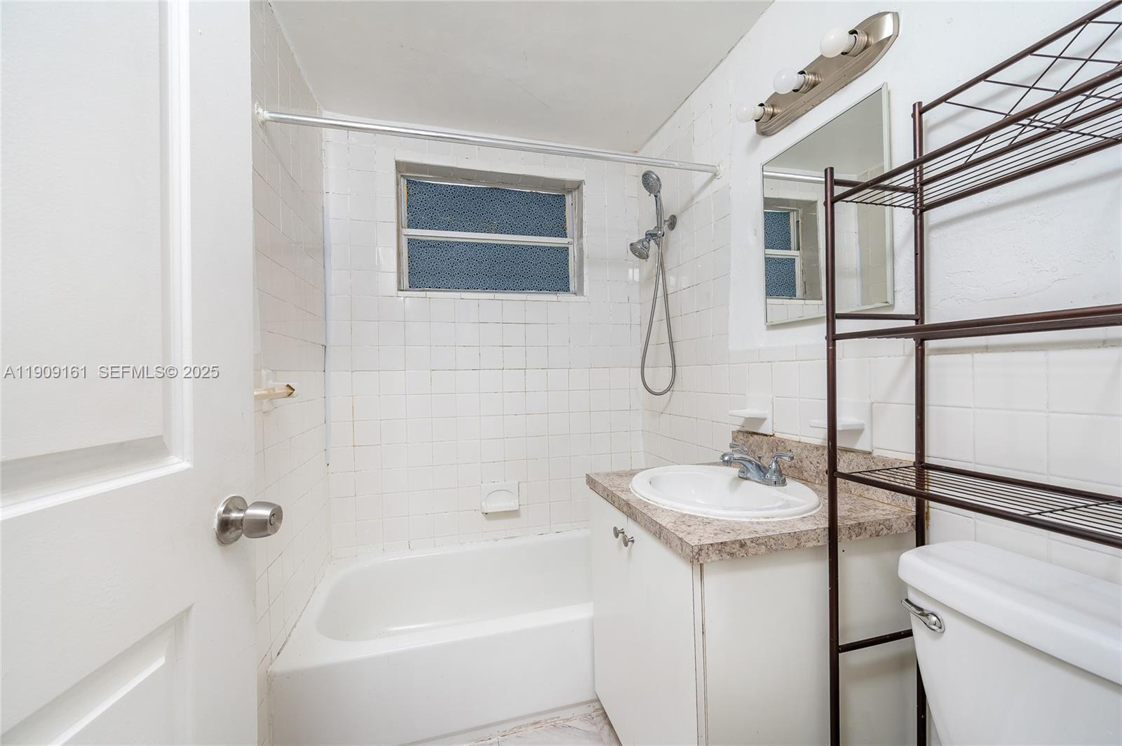 10015 Southwest 170th Terrace Miami, FL 33157 - Photo 7 of 14 a bathroom with a sink toilet and shower