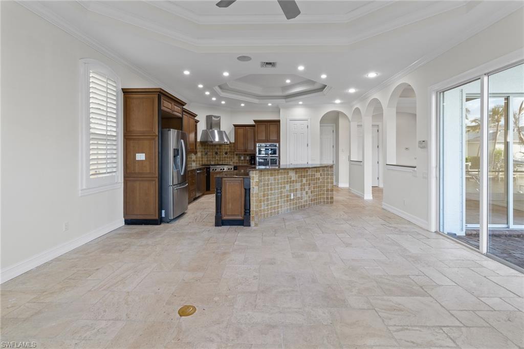 405 Trade Winds Avenue Naples, FL 34108 - Photo 13 of 48 a view of kitchen with refrigerator and window