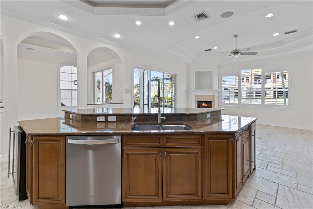 405 Trade Winds Avenue Naples, FL 34108 - Photo 15 of 48 a kitchen with cabinets and window