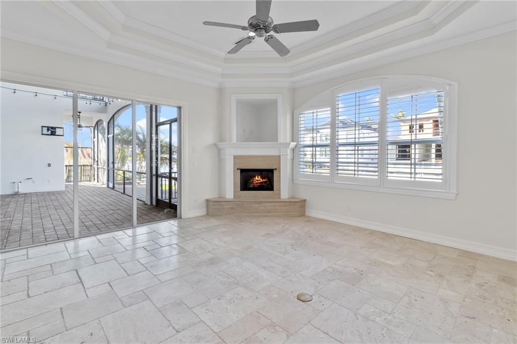 405 Trade Winds Avenue Naples, FL 34108 - Photo 16 of 48 a view of an empty room with window and fire place