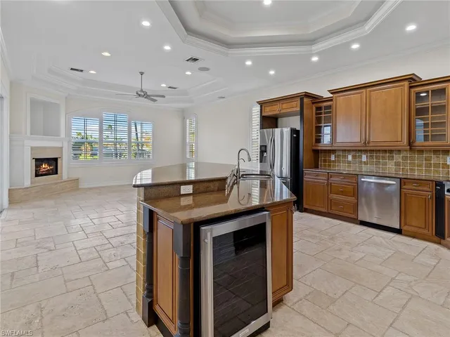 a view of a electric appliances and windows in a room