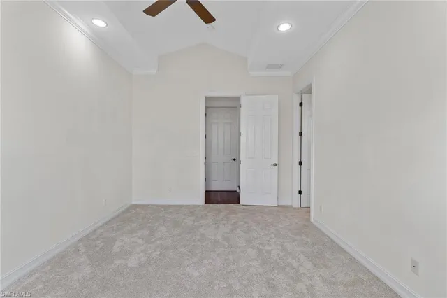 a view of a hallway with wooden floor windows and entryway