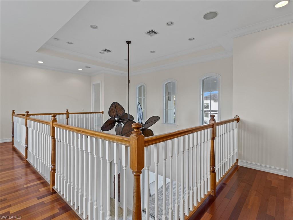 405 Trade Winds Avenue Naples, FL 34108 - Photo 27 of 48 a view of a hallway with stairs