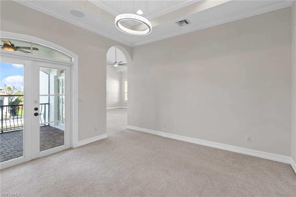 405 Trade Winds Avenue Naples, FL 34108 - Photo 33 of 48 an empty room with windows