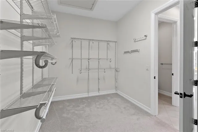 a balcony with table and chairs with wooden floor and fence