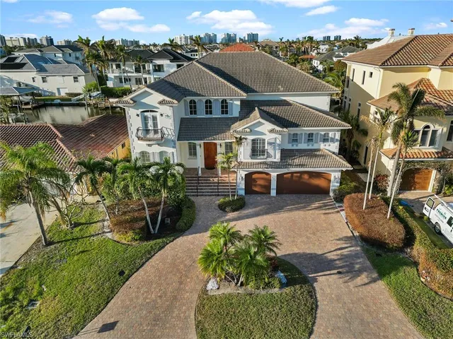 an aerial view of a city with ocean view
