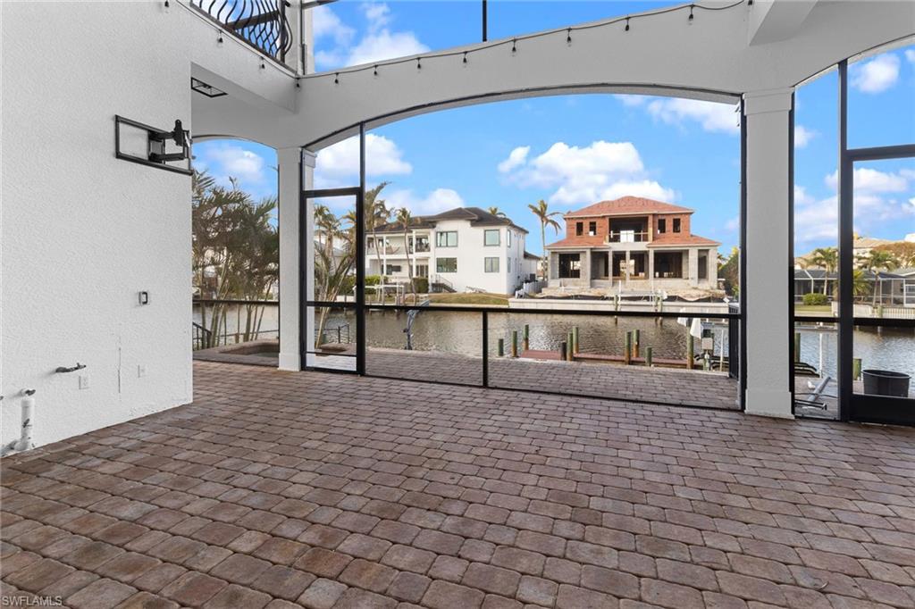 405 Trade Winds Avenue Naples, FL 34108 - Photo 6 of 48 a view of a living room with a large window