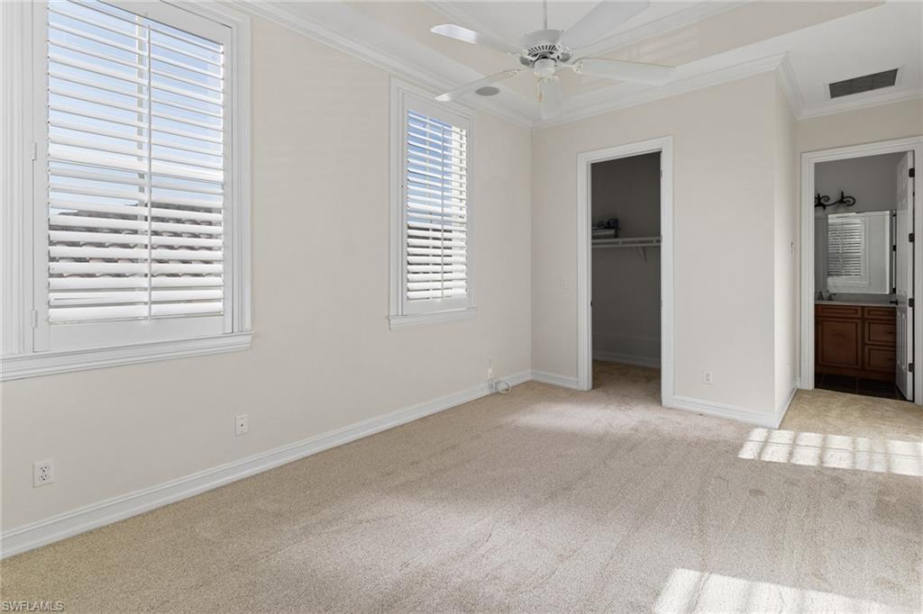 405 Trade Winds Avenue Naples, FL 34108 - Photo 8 of 48 a view of an empty room with a window