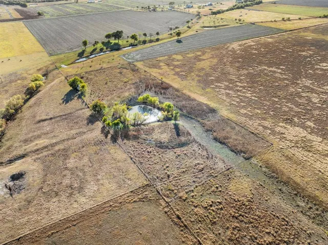 a view of a backyard of the house