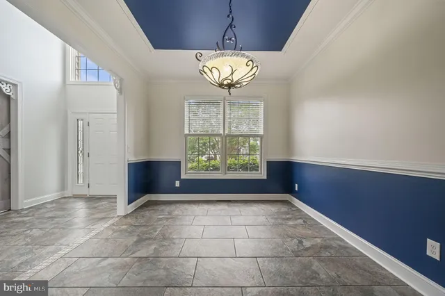 a kitchen with stainless steel appliances a sink a stove top oven a counter space and cabinets