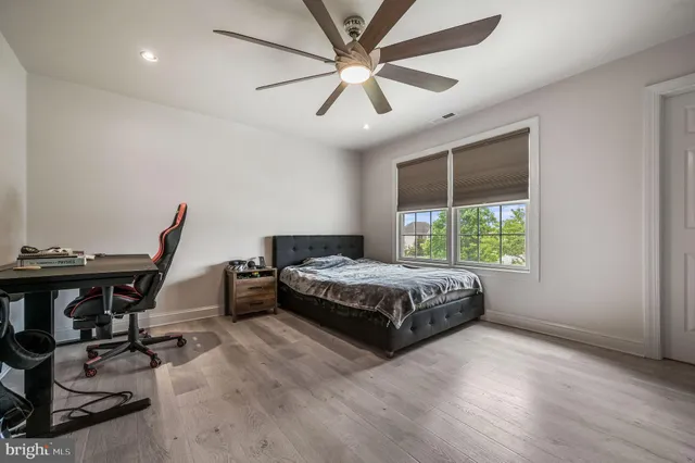 a spacious bedroom with a bed and a table