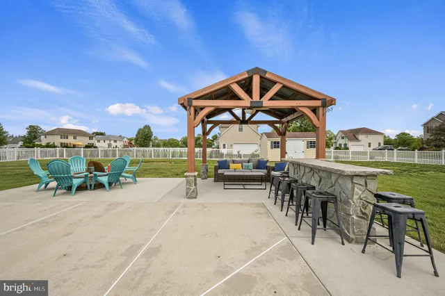 an outdoor space with furniture and garden