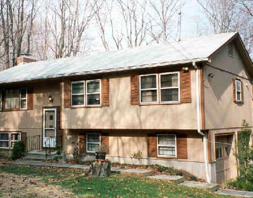 169 Haviland Road Ridgefield, CT 06877 - Photo 1 of 1 a front view of a house with a yard