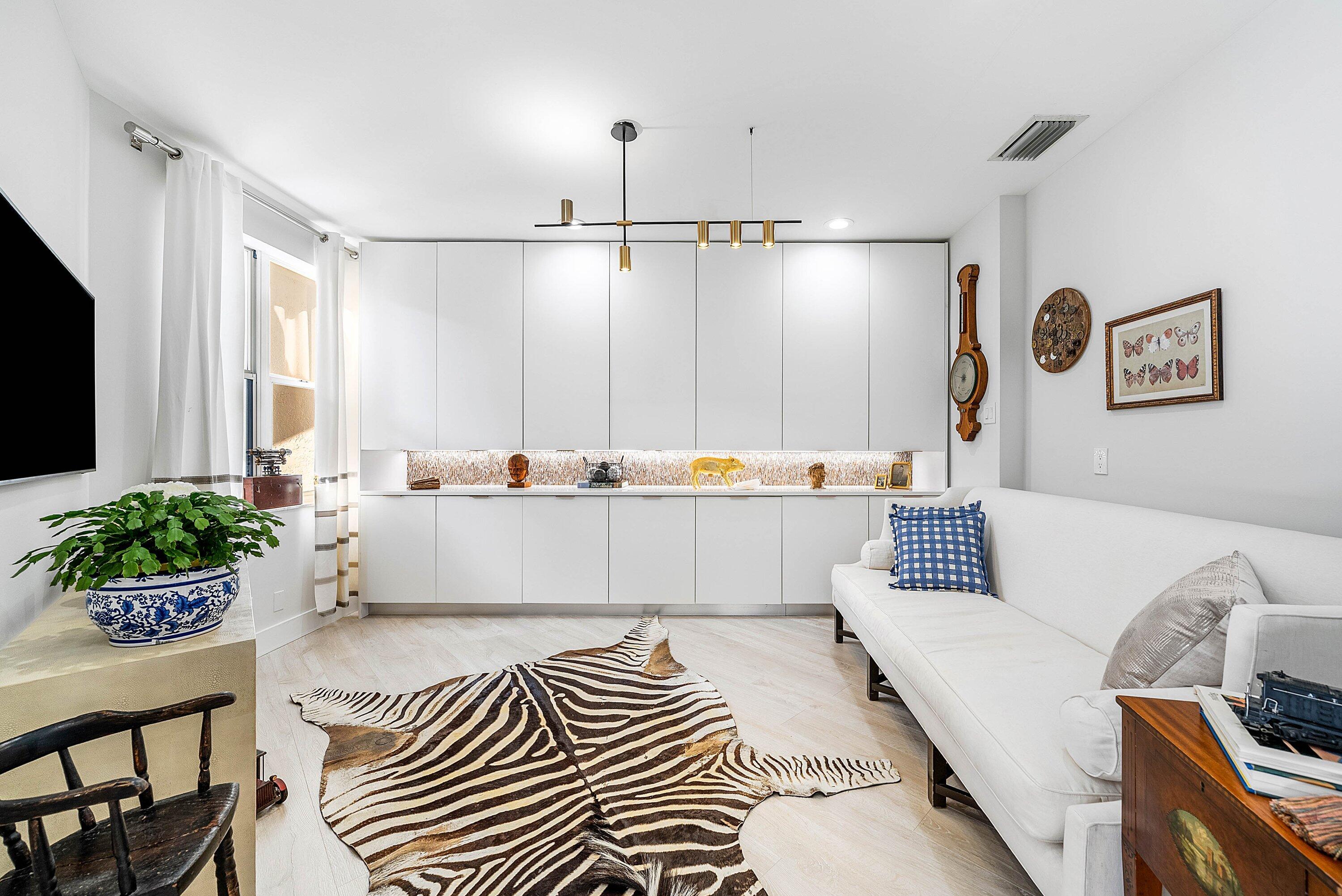 2224 Northwest 62nd Drive Boca Raton, FL 33496 - Photo 12 of 64 a living room with furniture and a flat screen tv