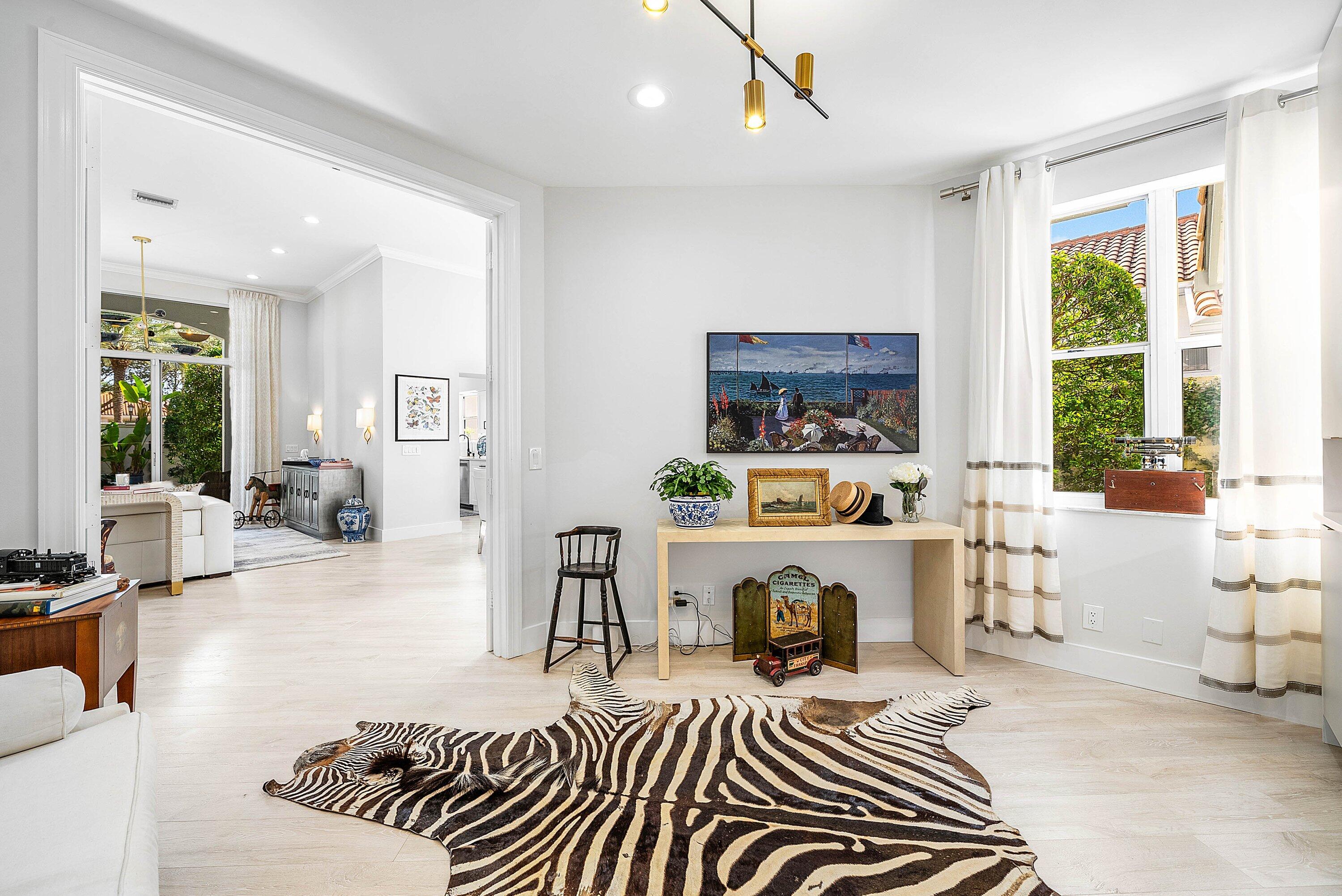 2224 Northwest 62nd Drive Boca Raton, FL 33496 - Photo 13 of 64 a living room with furniture a fireplace and a large window