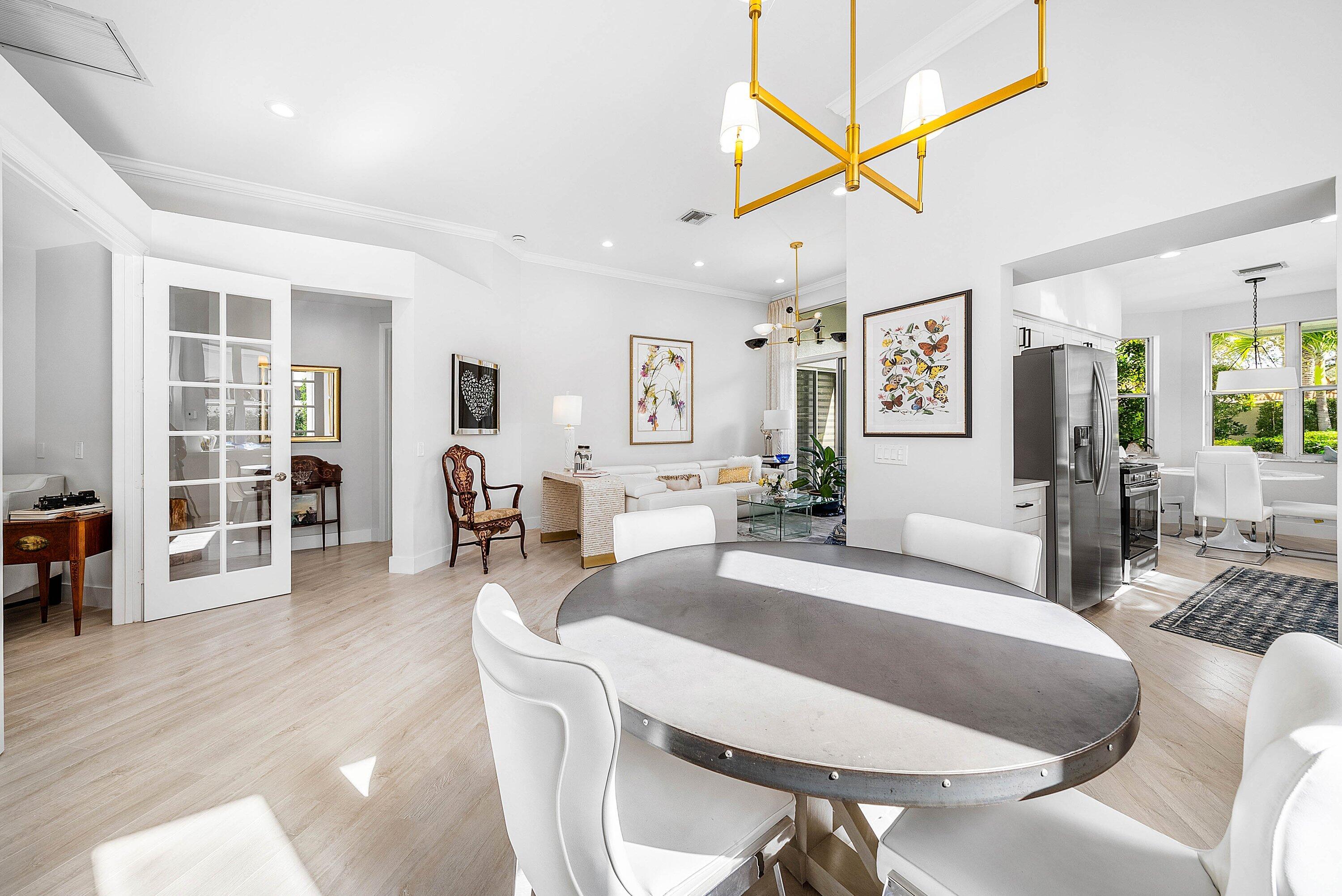 2224 Northwest 62nd Drive Boca Raton, FL 33496 - Photo 14 of 64 a living room with furniture a wooden floor and dining table