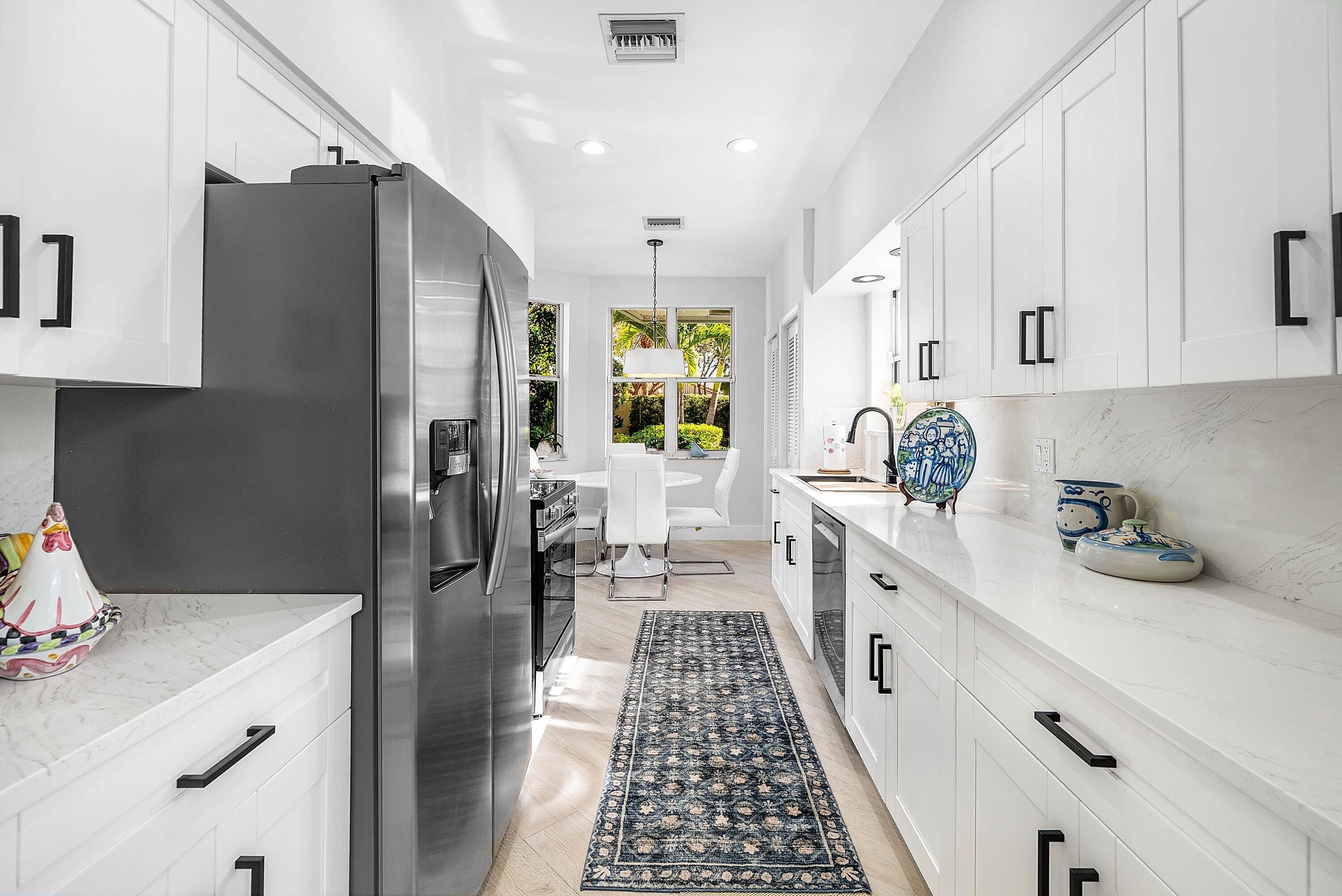 2224 Northwest 62nd Drive Boca Raton, FL 33496 - Photo 15 of 64 a kitchen with a sink stove and refrigerator
