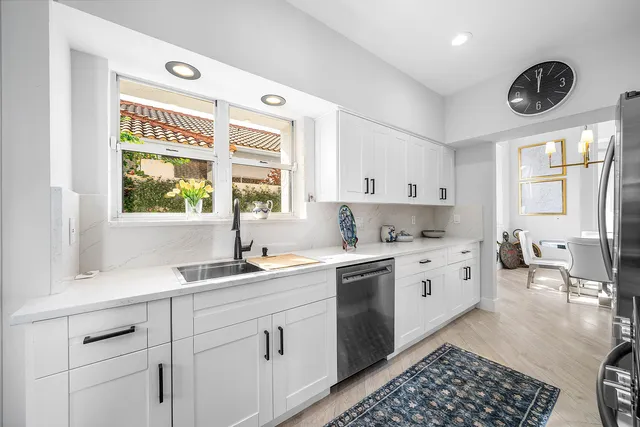 a kitchen with a stove a microwave and refrigerator