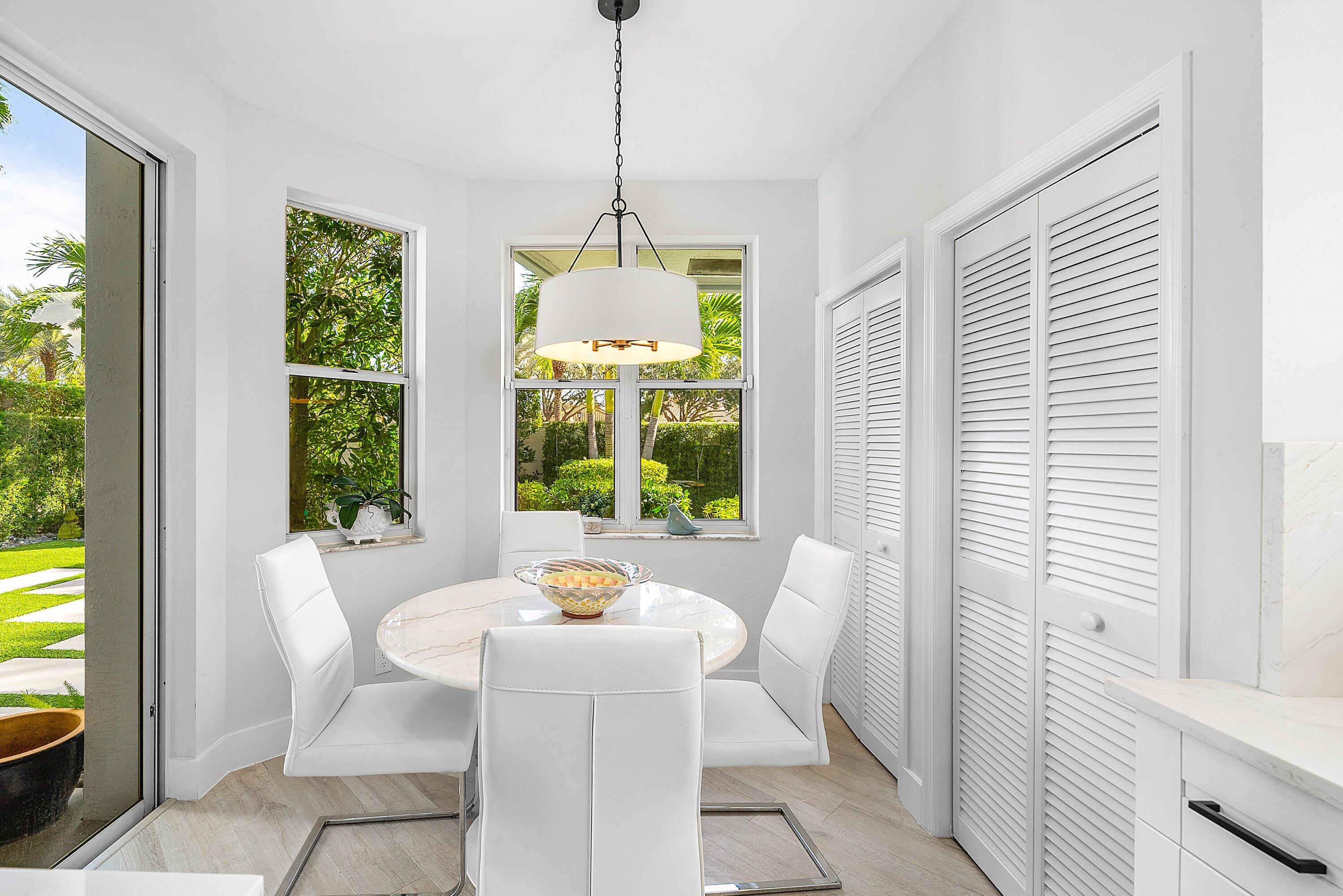 2224 Northwest 62nd Drive Boca Raton, FL 33496 - Photo 18 of 64 a view of a dining room with furniture window and outside view
