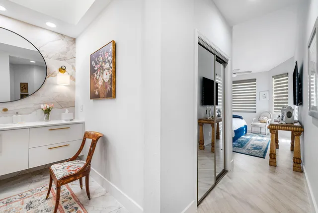 a bathroom with a double vanity sink mirror and a shower