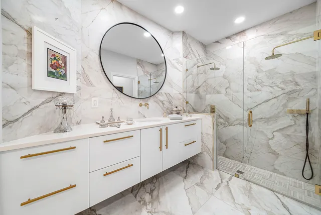 a view of a patio with couches table and chairs and potted plants