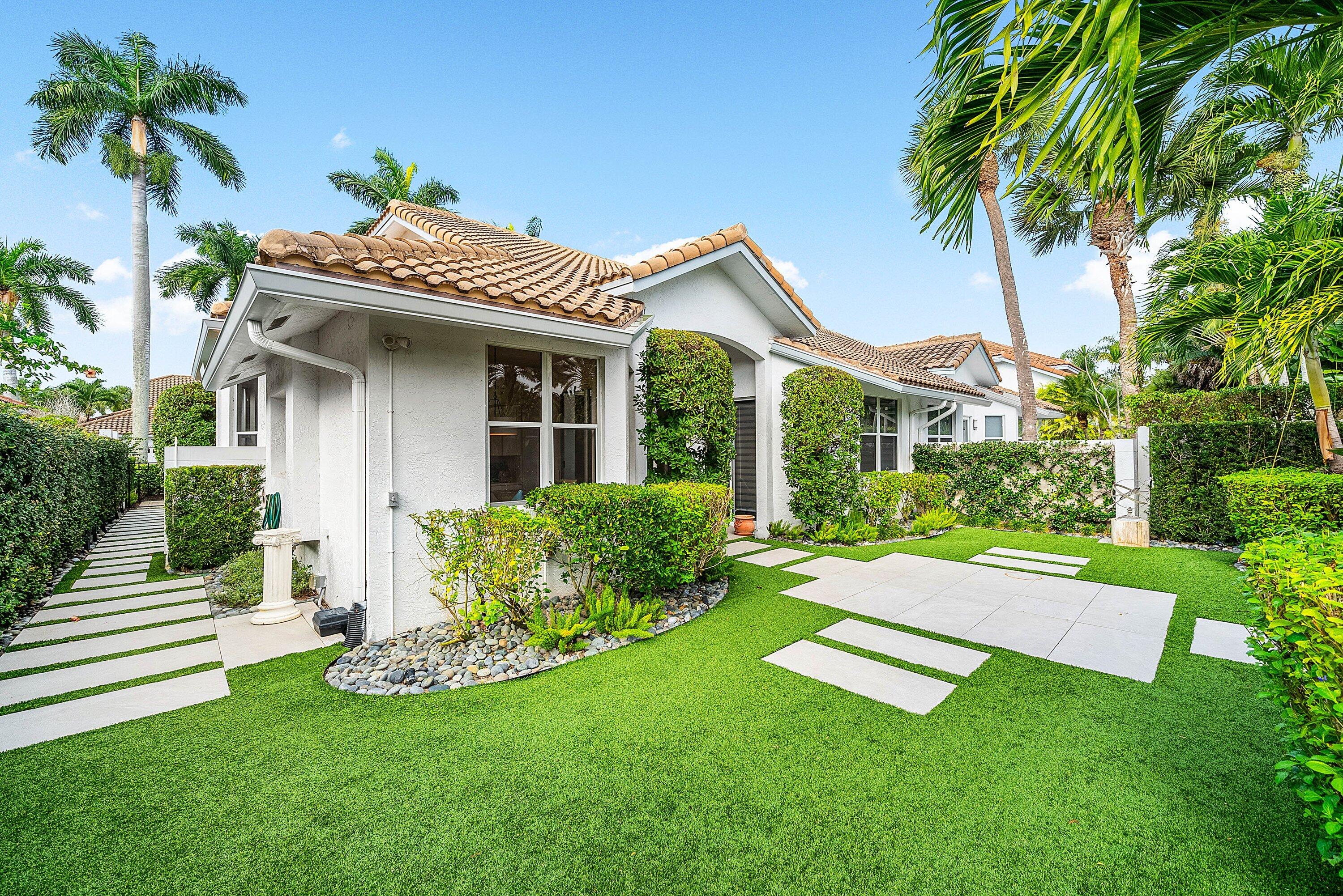 2224 Northwest 62nd Drive Boca Raton, FL 33496 - Photo 31 of 64 a view of a house with a yard and plants