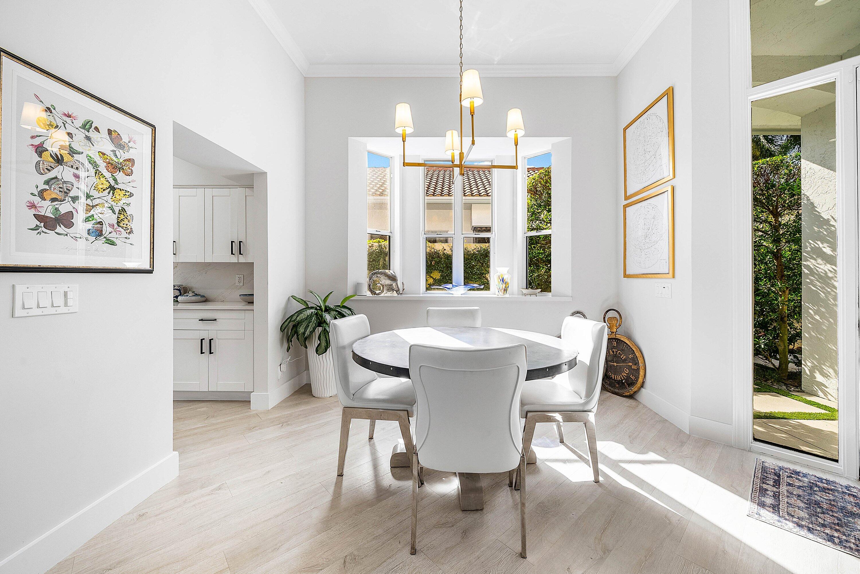 2224 Northwest 62nd Drive Boca Raton, FL 33496 - Photo 6 of 64 a view of a dining room with furniture window and wooden floor