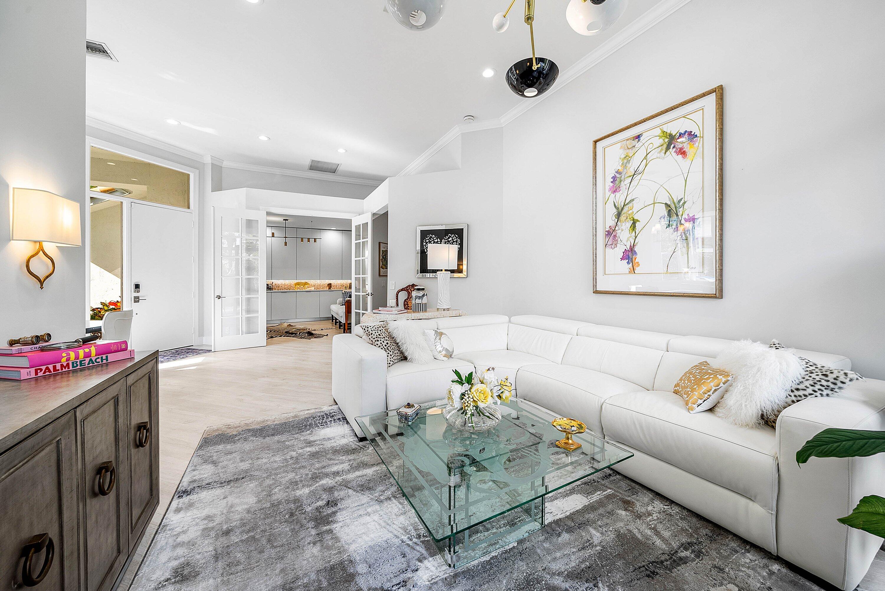 2224 Northwest 62nd Drive Boca Raton, FL 33496 - Photo 9 of 64 a living room with furniture and a flat screen tv