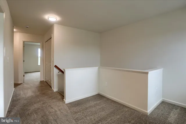 an empty room with a hallway