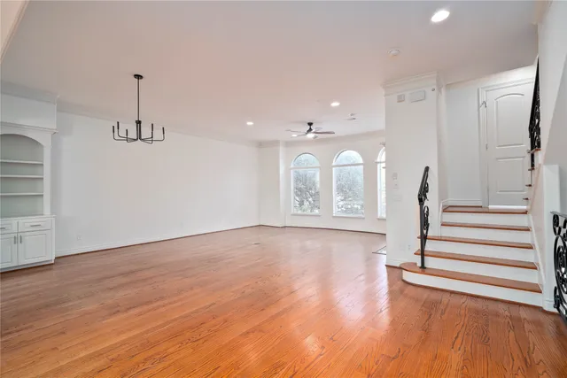 a view of entryway with wooden floor and stairs