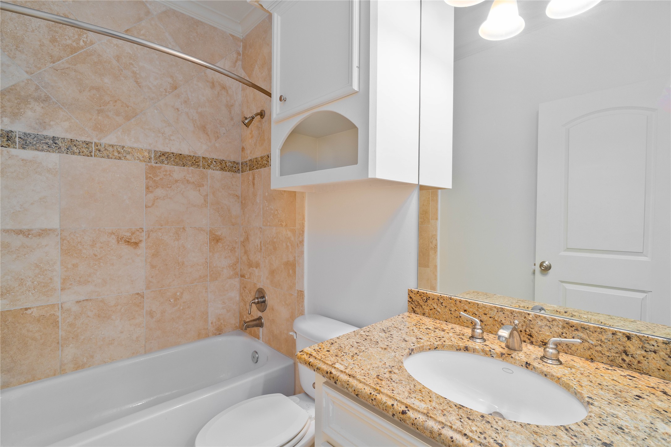 704 Welch Street Houston, TX 77006 - Photo 7 of 23 a bathroom with a granite countertop sink toilet and shower