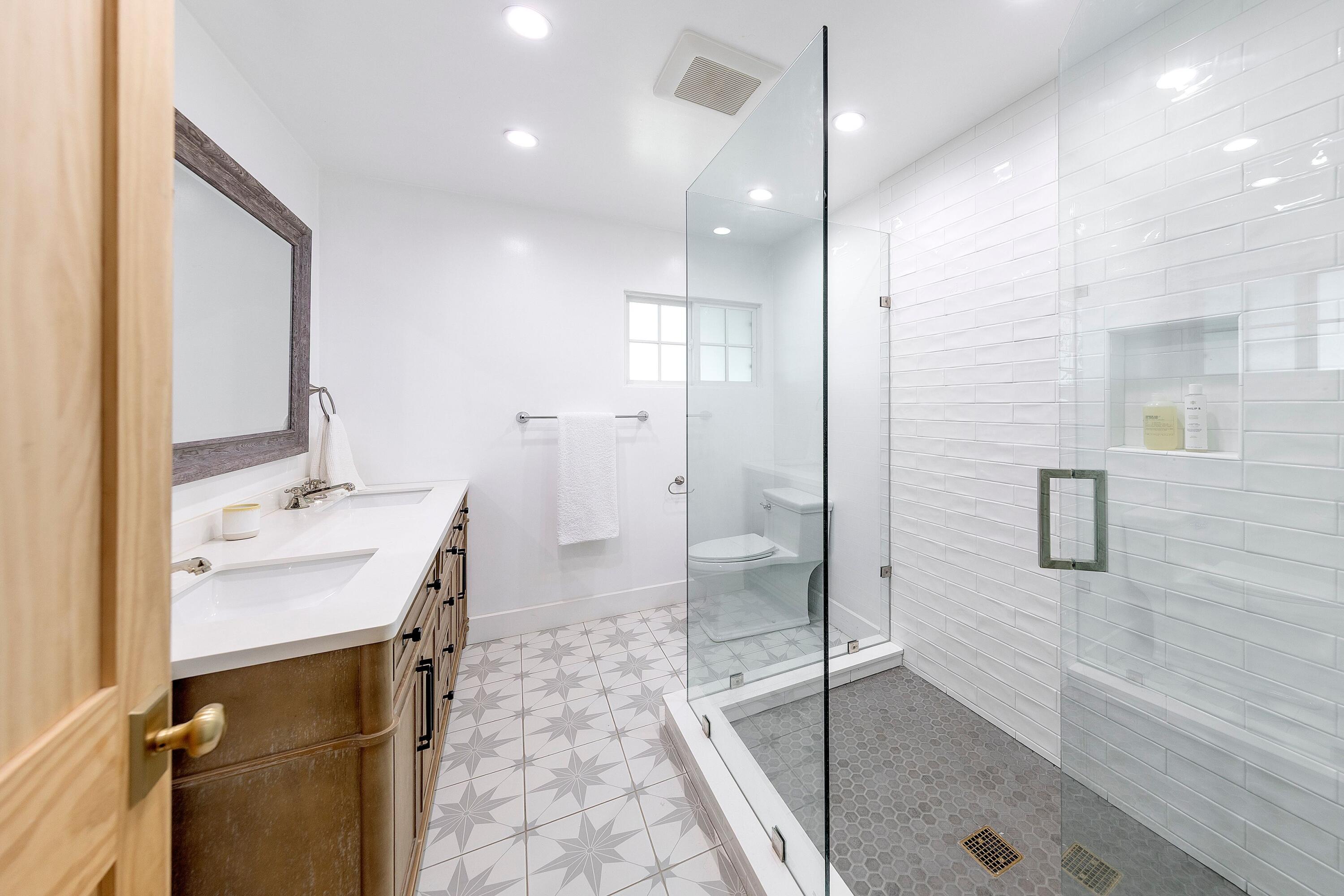 487 Hot Springs Road Santa Barbara, CA 93108 - Photo 26 of 47 a bathroom with a sink a toilet a mirror and shower