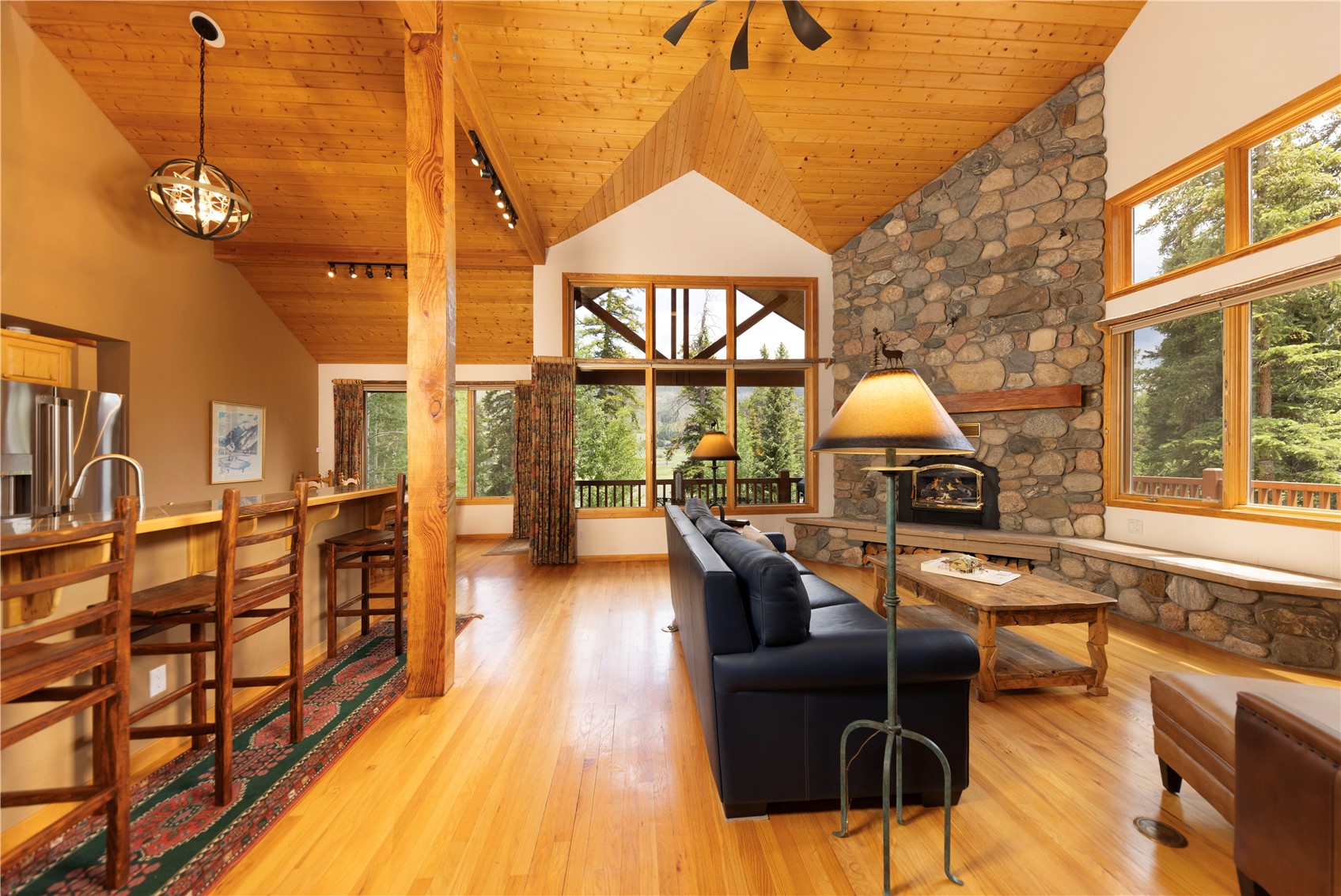760 Penstemon Road Keystone, CO 80435 - Photo 4 of 39 Living room featuring plenty of natural light, high vaulted ceiling, and wood ceiling