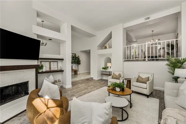 a living room with furniture and a fireplace