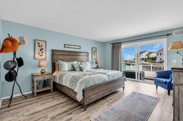 a bedroom with a bed a table and chair