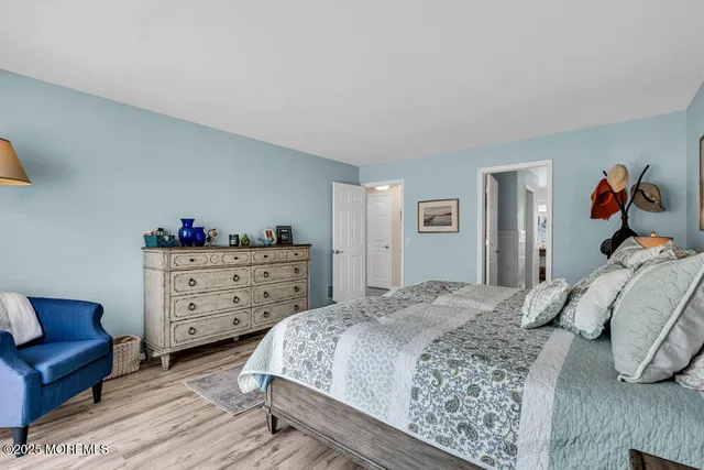 a bedroom with a bed and closet