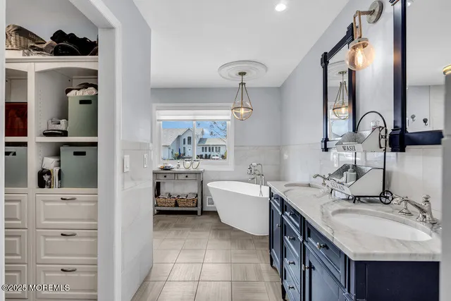 a bathroom with a sink double vanity and a mirror