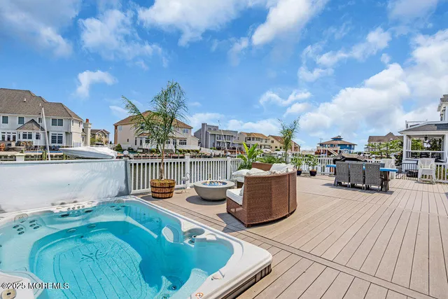 a swimming pool with outdoor seating yard and barbeque oven