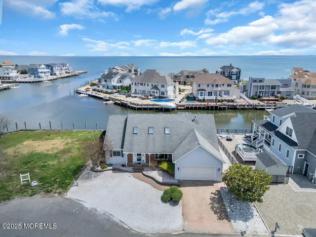 a view of a lake with a house in the background